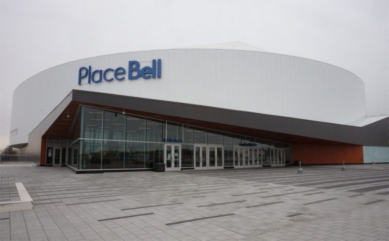 Place Bell: fin d’un litige vieux de six ans Le changement de site pour la construction de la Place Bell, en 2012, avait mené à l'expropriation du Fonds immobilier de solidarité FTQ, dont le litige qui demeure pourrait bien se régler avec la concession des terres en friche du bois du Trait-Carré.